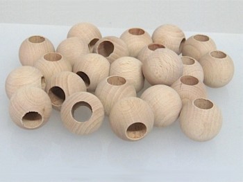 Bolas de madera Ø30 mm.c/T.14 mm. / 100 uds.